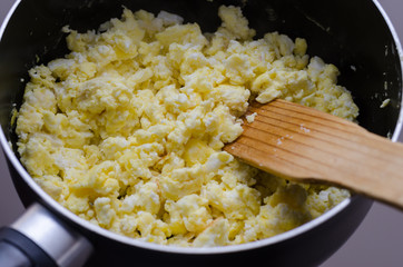 Freshly prepared scrambled eggs in pan