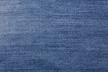 Naklejka premium Denim jeans tekstura tło z rozdarty. Faktura kolorowej tkaniny bawełnianej. Szyte tekstury dżinsy tło. Modny guzik do dżinsów. Kieszeń i nit na dżinsach. Struktura włókna i tkaniny.