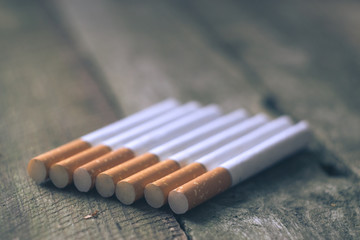 Cigarettes on a wooden board