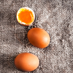 Hard boiled eggs with orange yolk in rustic style  on wooden bac