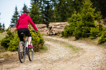 Fototapeta premium Middle-aged woman riding bicycle 