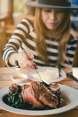 Young Hipster Asian Woman are Enjoy Eating Yunnan Stewed Pork