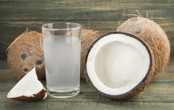 Coconut water on the wooden table (Cocos nucifera)