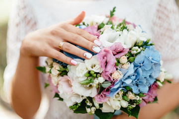 Fototapeta na wymiar the bride holding a bouquet. wedding flowers. soft focus.