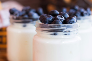 Yogurt with berries in a glass jar