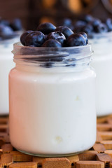 Yogurt with berries in a glass jar
