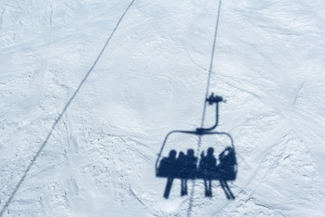 Skiers on a ski lift