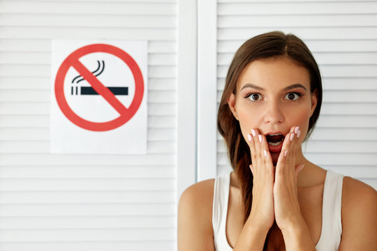 Smoking. Beautiful Woman With No Smoking Sign On Background