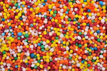 Fototapeta na wymiar Colorful confectionery Colorful candy background Multi-colored candy decorative sprinkles Multi-colored sprinkles for cake decoration or for pastry decoration