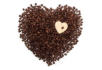 Heart made of roasted coffee beans in a white background.