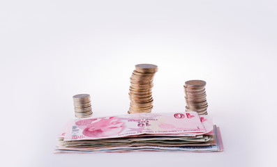 Turkish Lira coins and banknotes side by side