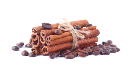 Coffee beans and cinnamon sticks isolated on white background