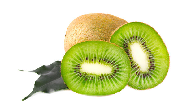 Ripe juicy kiwi slices with green leaves isolated on white background