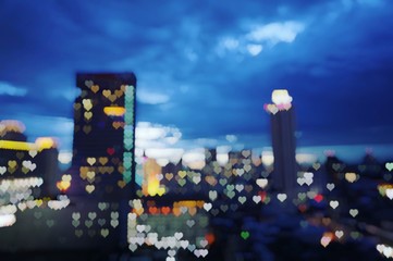 heart shape bokeh light of city scrape at twilight time