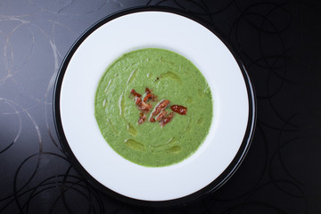 Green soup with tomatoes