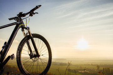 Naklejka na ściany i meble Bicycle silhouettes with sky and sun