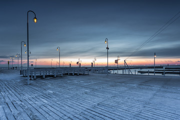 Cold winter morning, Pier in Sopot at sunrise time with amazing colorful sky. Poland.