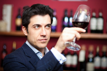 Man tasting red wine