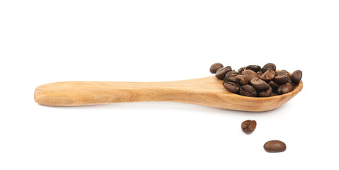 Wooden spoon full of coffee isolated