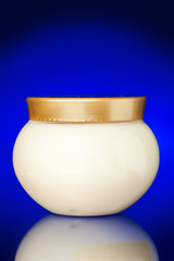 Glass jar of cream for body.