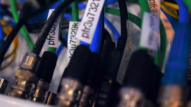 Much BNC wires are included in back side the electronic equipment. Shot in motion