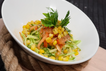 salad with corn, tomato, cucumber and cabbage
