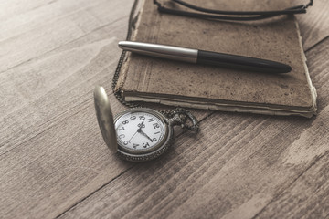 Vintage pocket  watch with pen and paper