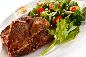 Grilled steaks and vegetables