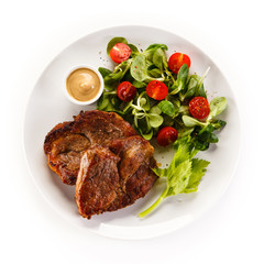 Grilled steaks and vegetables