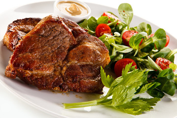 Grilled steaks and vegetables