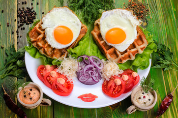 Fried eggs and tomatoes on a white plate.