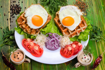 Fried eggs and tomatoes on a white plate.