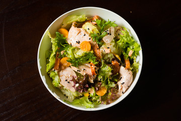 salad of chicken and vegetables with herbs