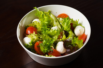 vegetable salad with cheese and tomatoes herbs
