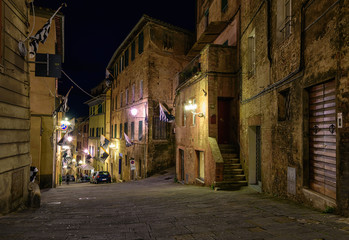 Medieval narrow cozy street in Siena, Tuscany, Italy