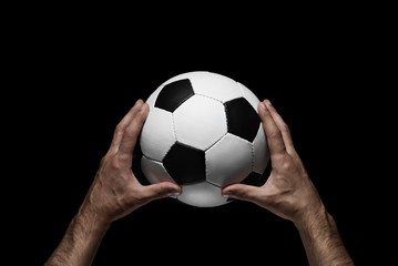 soccer ball in male hands