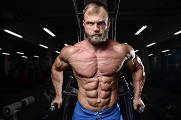 Fototapeta na wymiar brutal muscular man with beard unshaven fitness model healthcare