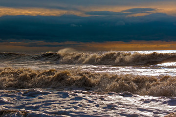 Sunny stormy waves on the shore