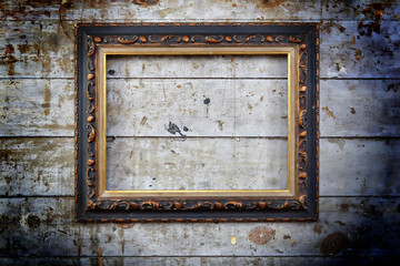 Old blank picture frame on wall