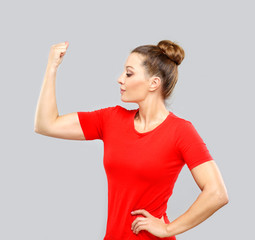 Fototapeta premium Portrait of woman tightens her fist, looking at camera.