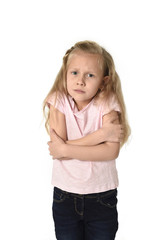 Fototapeta premium young little child girl having cold gesturing and trembling isolated on white background