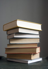 Books on old wooden table. Scientific literature, fairy tales, n