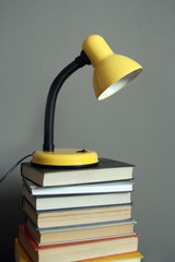 Table lamp on the books. Knowlage- it light
