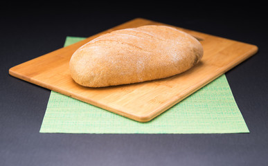 Close-up of traditional bread on cooking board