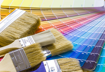 Painter and decorator work table with house project, color swatc