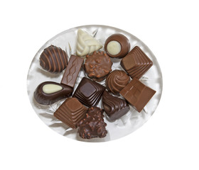 Glass plate with a variety of delicious pralines