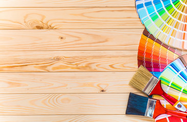 Painter and decorator work table with house project, color swatc