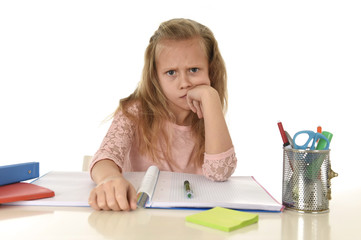  little schoolgirl sad and tired looking depressed suffering stress overwhelmed by load of homework