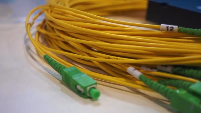 Coil new wires with optical fiber with a protective cap at the end of. Shot in motion