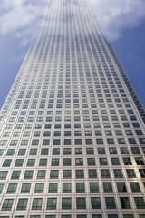 Multistory building covered in clouds on top